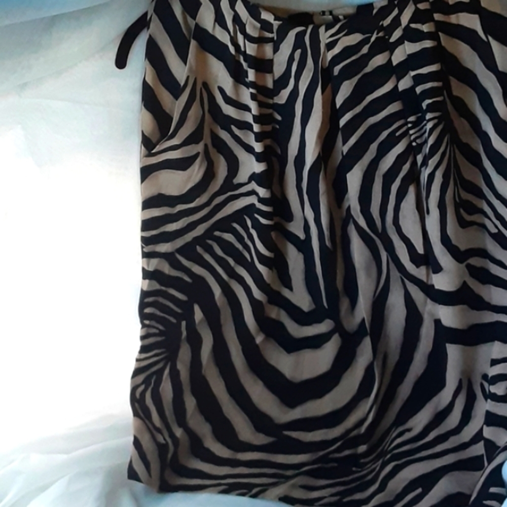 100% Silk Size 10 Petite.  (Smaller than that) measure next